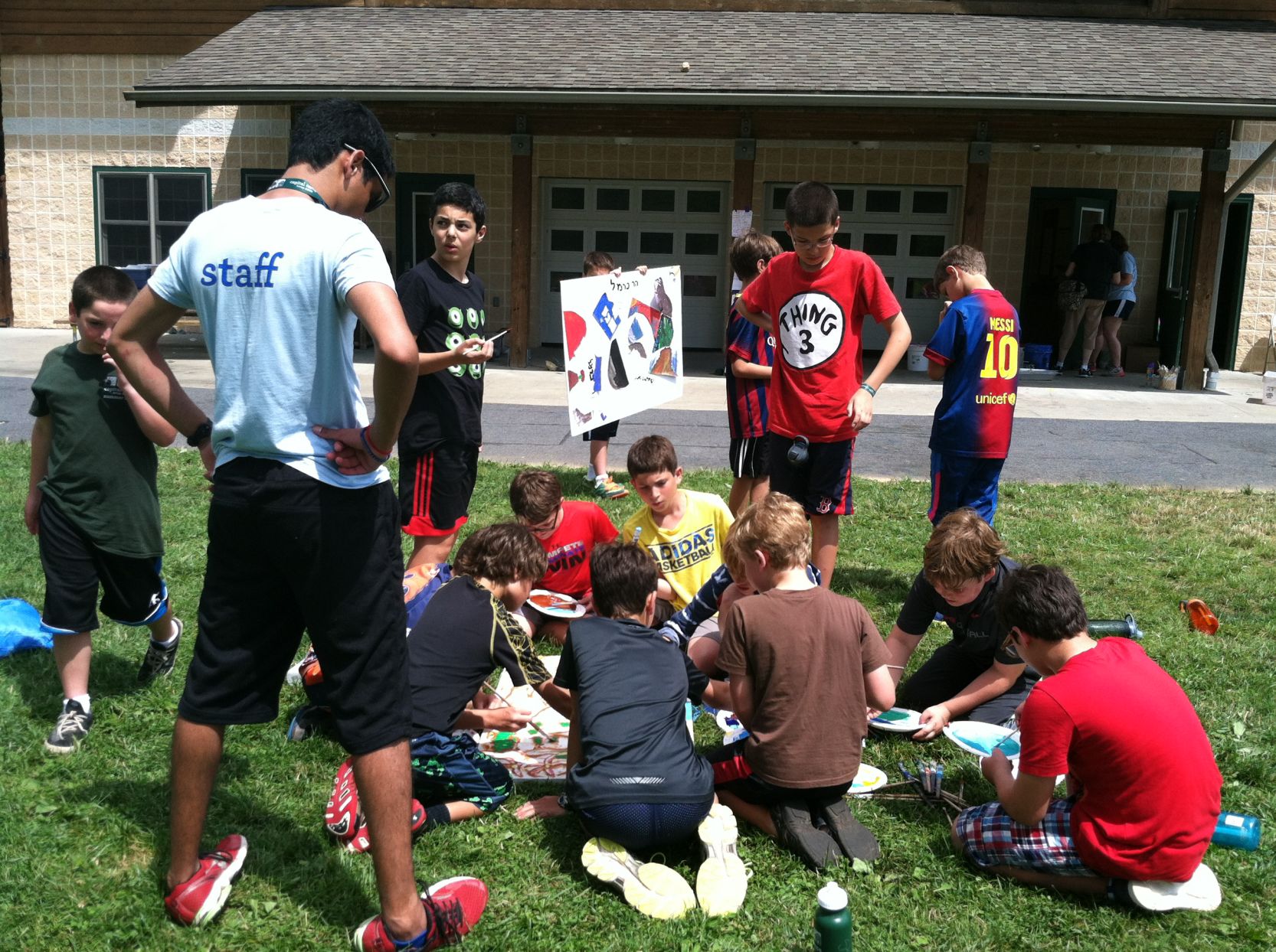 Campers work on a community art project